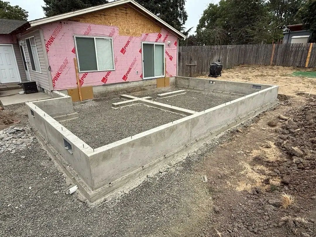 Finished concrete foundation for a home renovation and addition project in Lane County, Oregon.