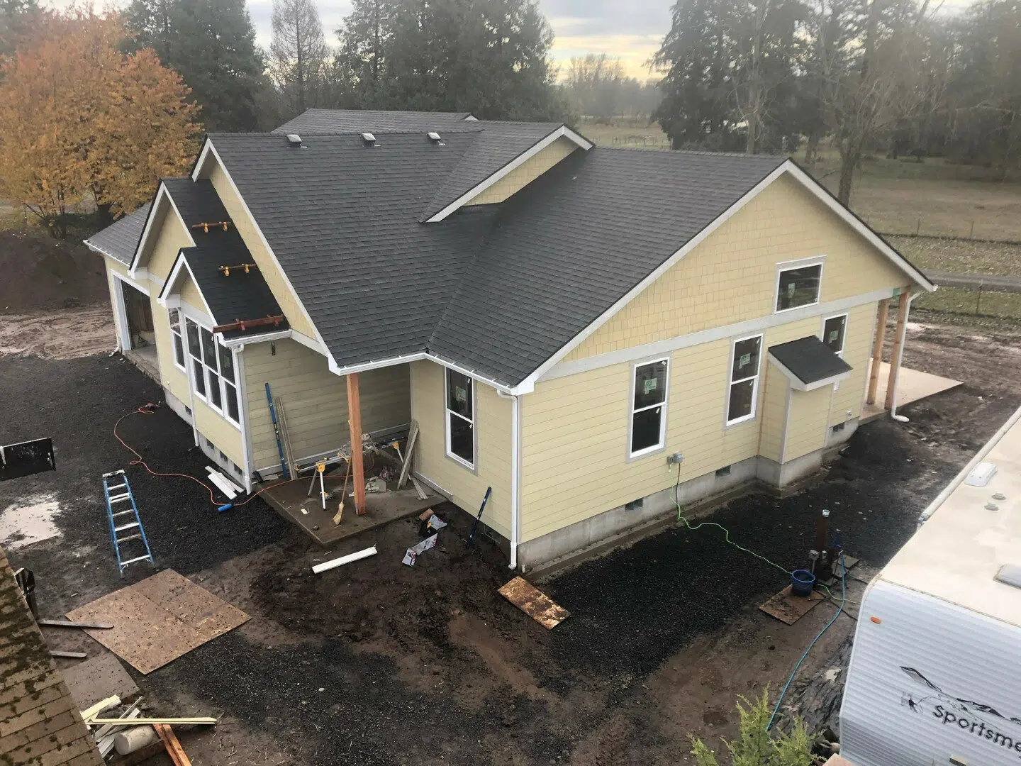Home building project in progress with excavation and foundation work in Lane County, Oregon.